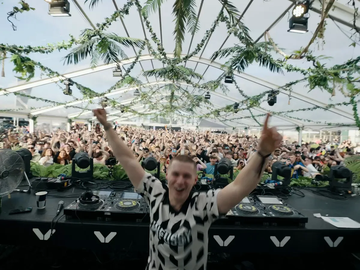 A Terminal V DJ performing to a packed daytime crowd