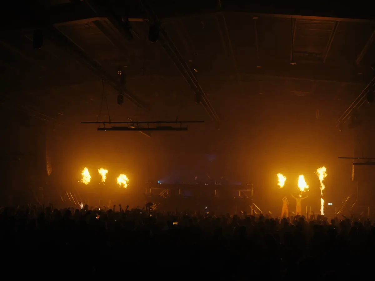 Pyrotechnics lighting a packed Terminal V dance floor
